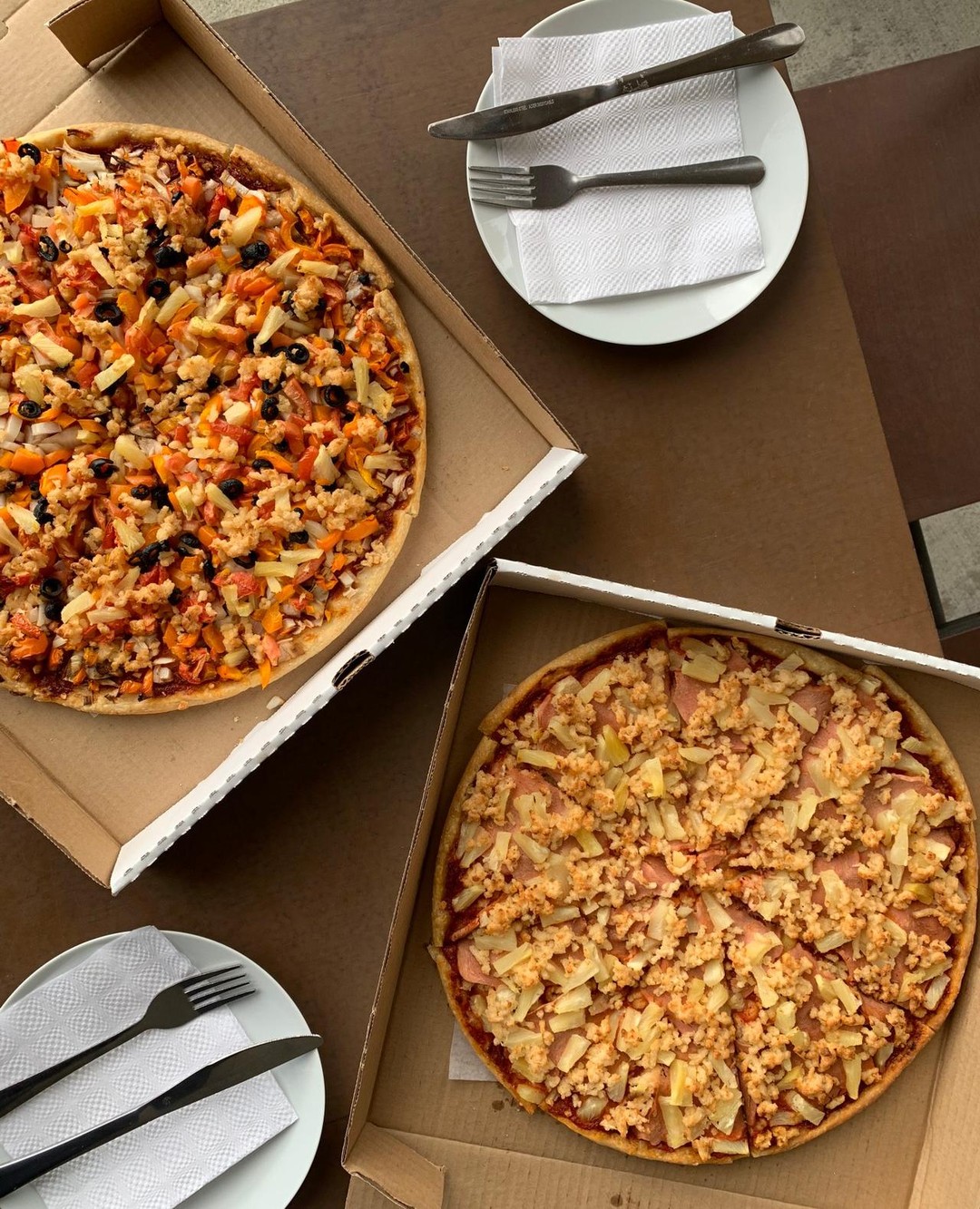 Open pizza boxes ready for a group meal