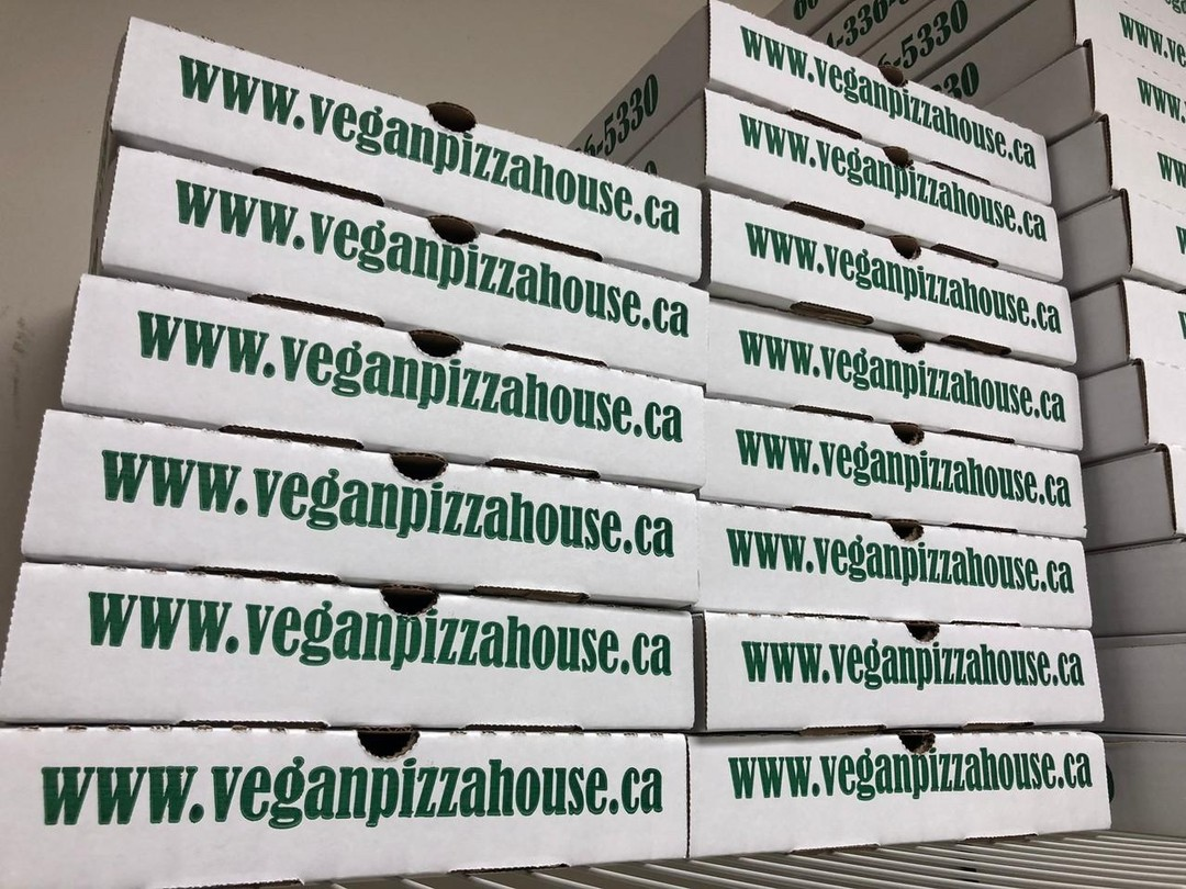 Stacked Vegan Pizza House pizza boxes for large orders